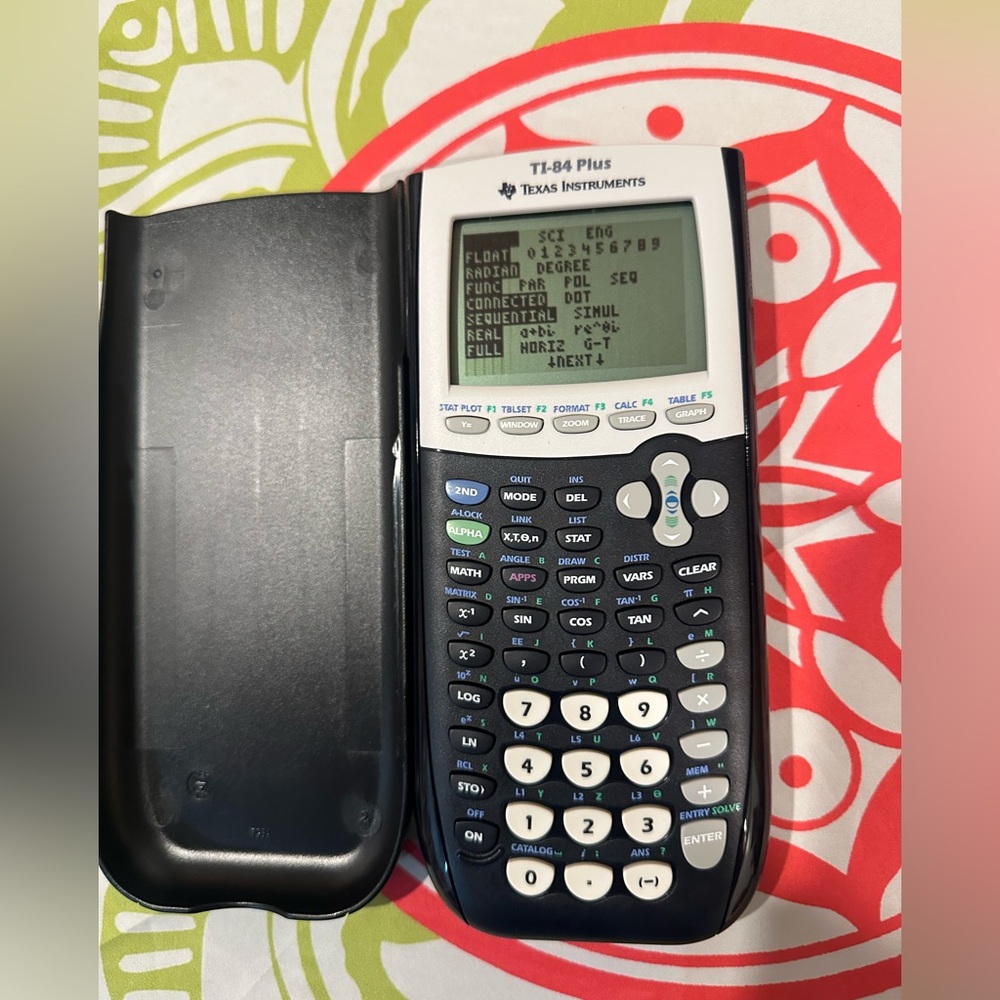 Texas Instruments TI-84 Plus Graphing Calculator - Black and White Like New